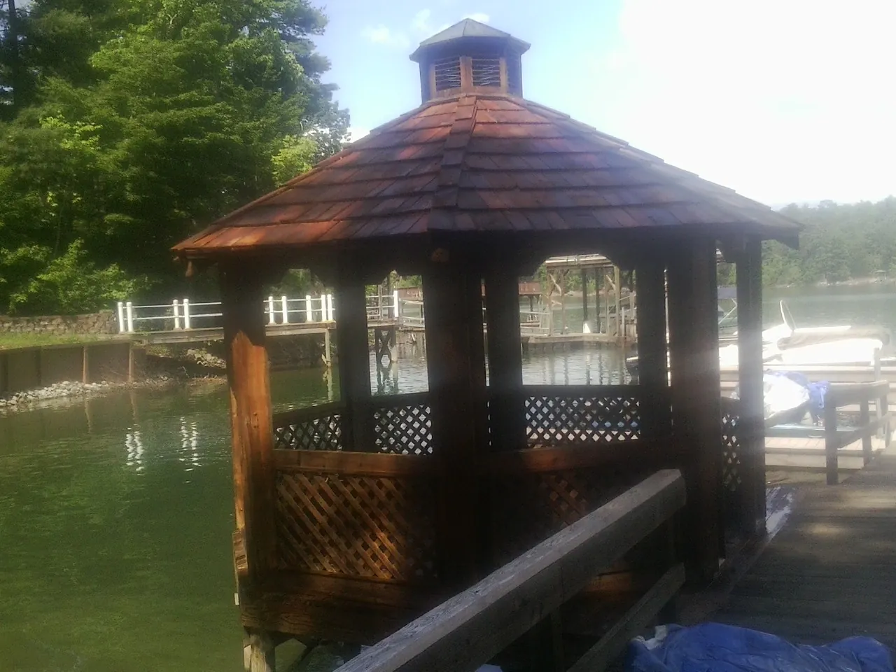 Cedar shake gazebo roof rebuilt on a lake dock in Livingston Manor